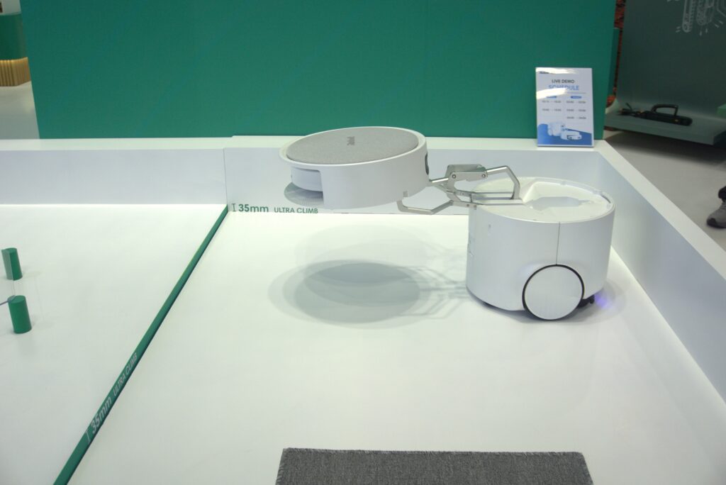 I Watched a Floor Washing Robot Mothership Deploy a Roomba Using a Mechnical Arm