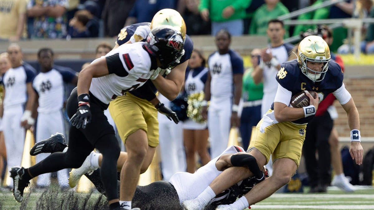 Northern Illinois football player makes a tackle