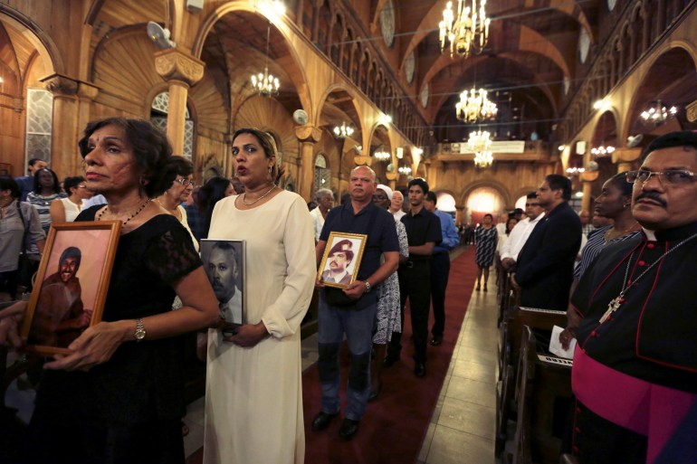 Relatives attend a commemoration for the 15 activists killed in Suriname in 1982