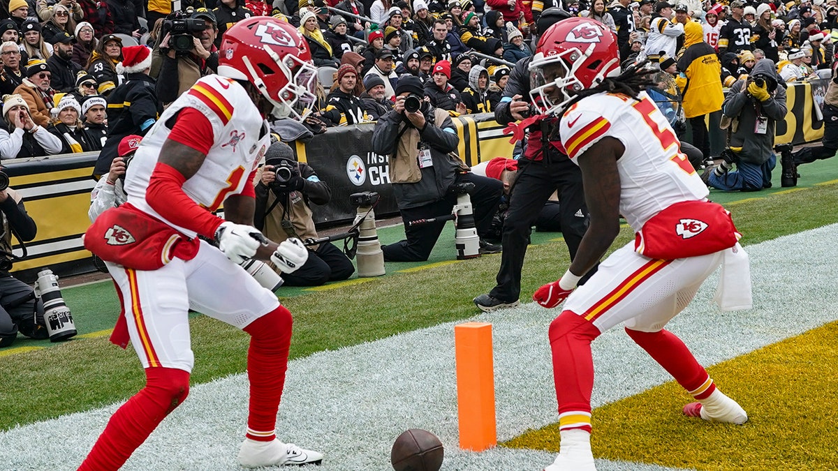 Xavier Worthy and Hollywood Brown celebrate