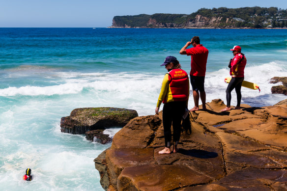 Rescuers at North Avoca Beach search for the missing boy on Wednesday.