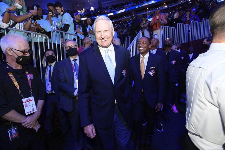 Retired basketball player walking at stadium.