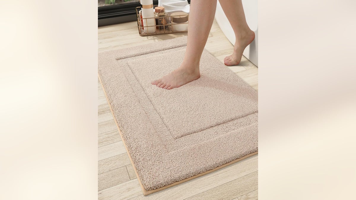 These Color & Geometry mats at Amazon feature a soft step microfiber with rubber backing that helps to prevent slippage.