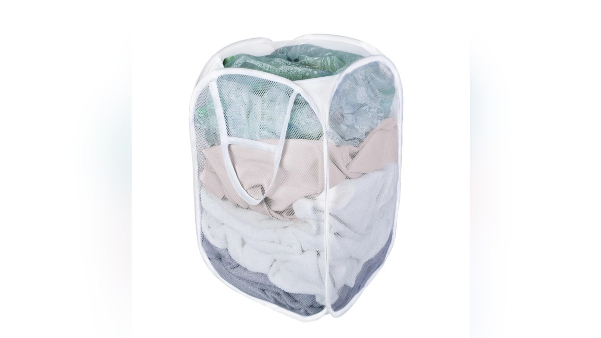 A portable laundry hamper by Mainstays at Walmart is essential in a dorm room. 