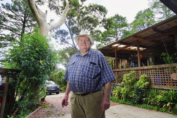 George Harmon at his home in Belgrave Heights near the lemon-scented eucalypt that snapped and crushed his verandah roof. 