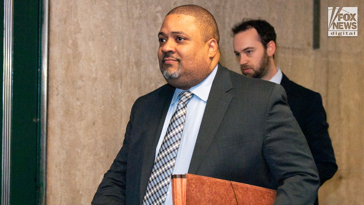 Manhattan District Attorney Alvin Bragg walks in the hallways of Manhattan Supreme Court