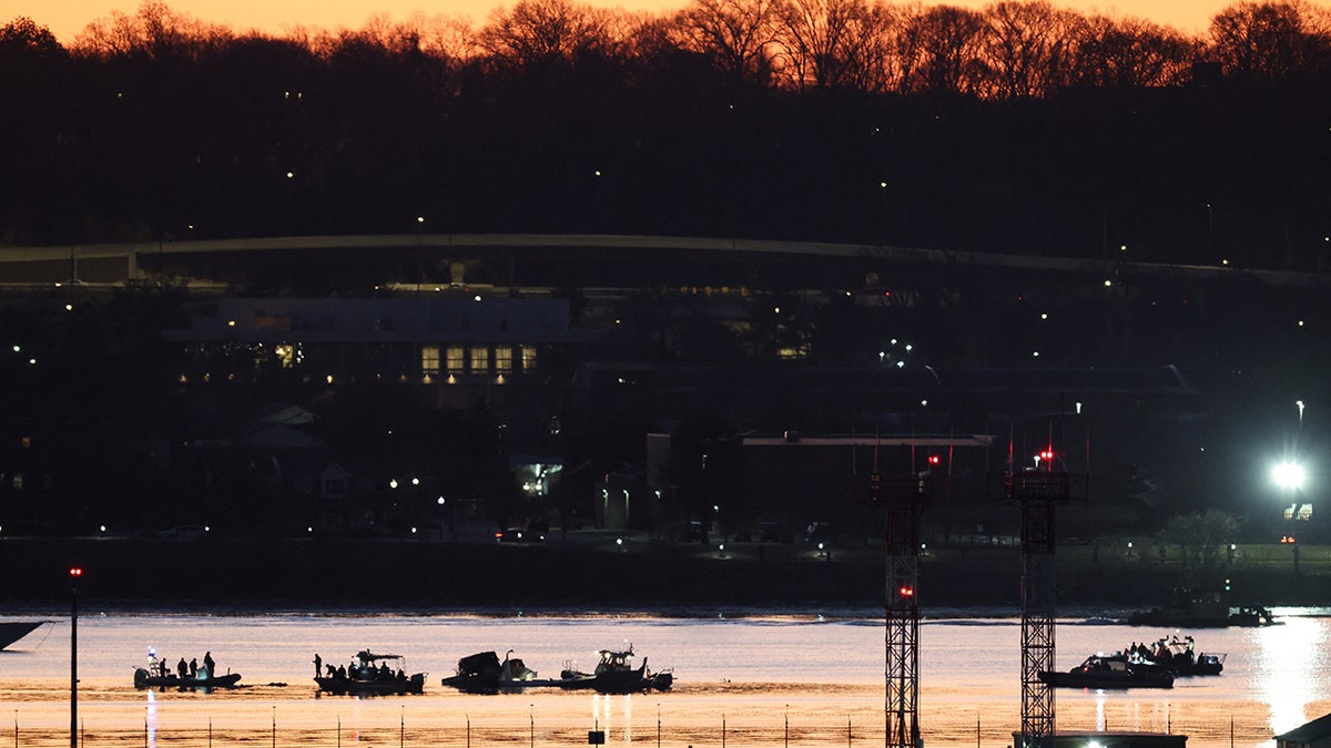 Rescuers work on the Potomac River in Washington DC after a tragic plane crash