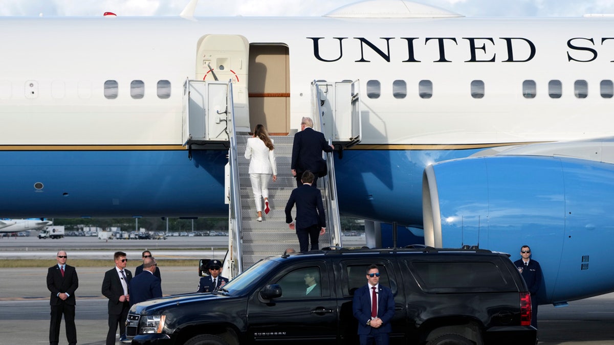 President-elect Donald Trump, with Melania and Barron Trump, board an Air Force Special Mission plane at Palm Beach International Airport on Saturday. 