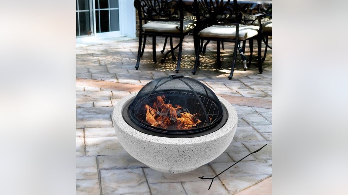 A wood-burning fire pit from Teamson is a classic choice for warmth and ambiance.