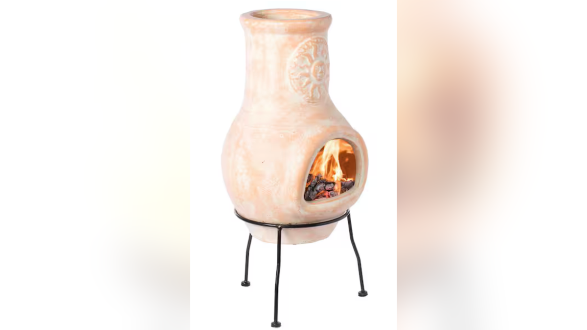 A classic clay chiminea radiates heat more effectively than an open fire pit.