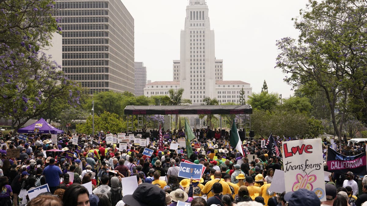 People attend a rally against the detention of SEIU California and SEIU-USWW union president David Huerta amid federal immigration sweeps, with the Los Angeles City Hall in the background, in downtown Los Angeles, California, U.S. June 9, 2025.