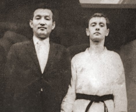 Jack Rozinszky, right, in 1967, in Seoul, Korea, receiving his black belt from his instructor Lee Chong Woo.