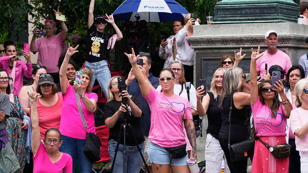 Karen Read fans greet her outside of court.