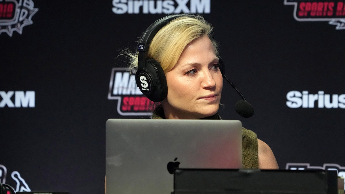 Michelle Beadle looks on