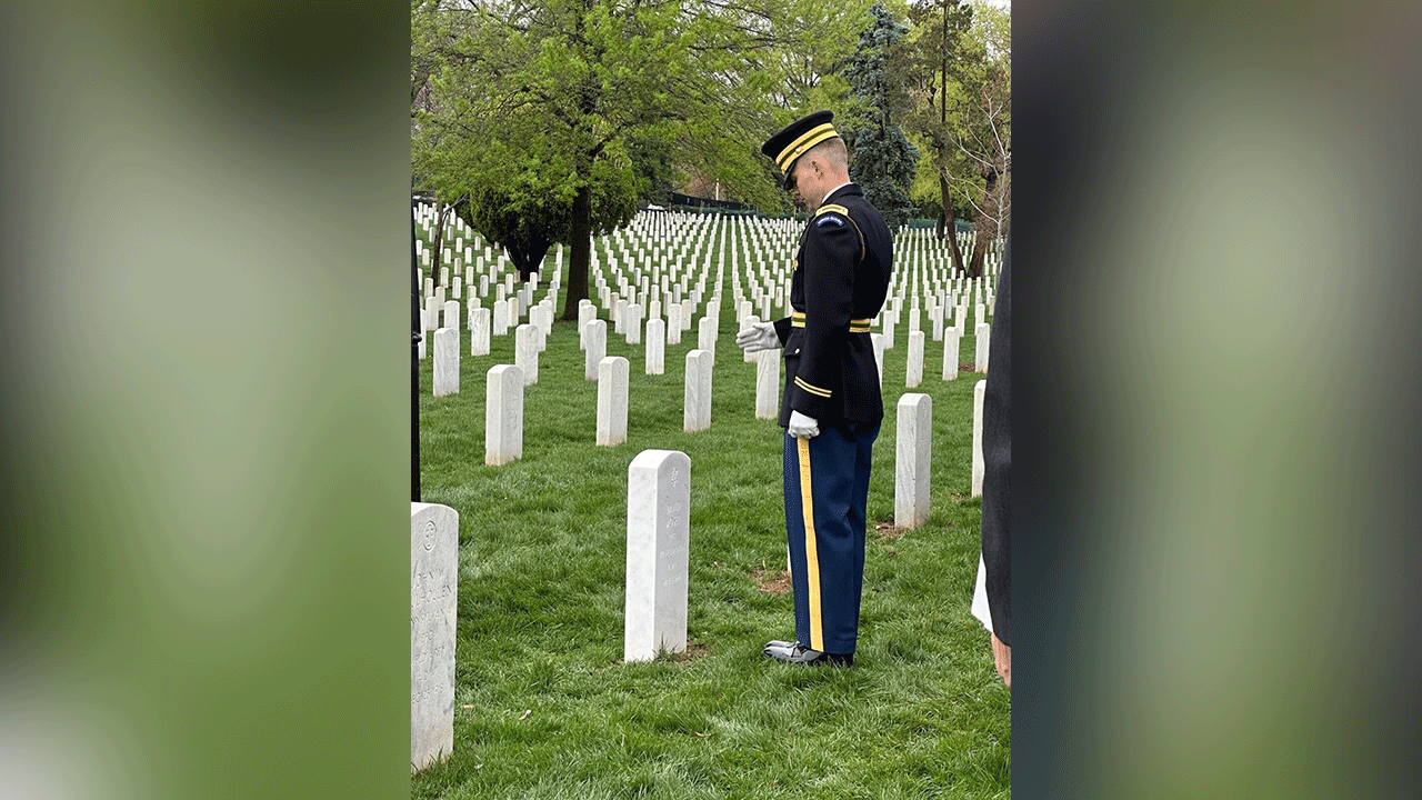 Soldier pays his respects at Arlington.