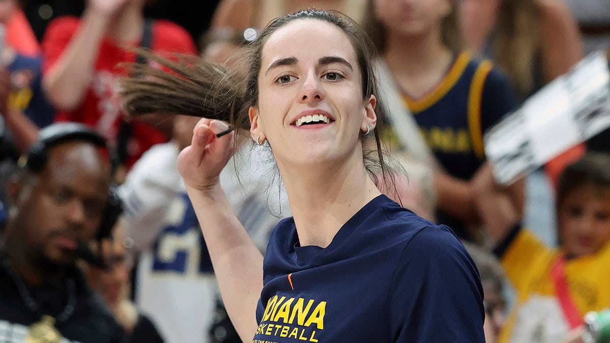 Caitlin Clark grins