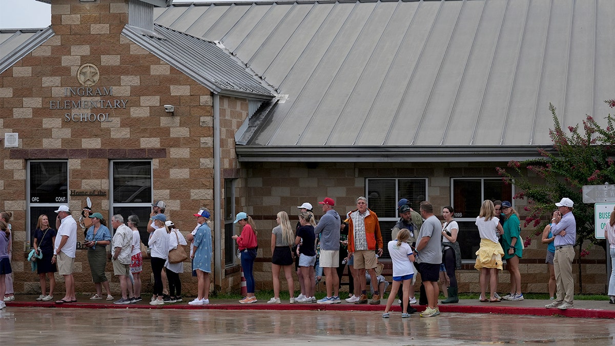 Families wait to see loved ones at reunification center