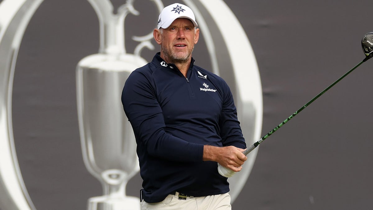 Lee Westwood swings golf club