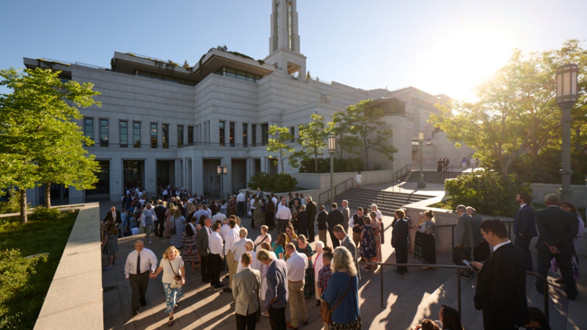 People standing outside conference center
