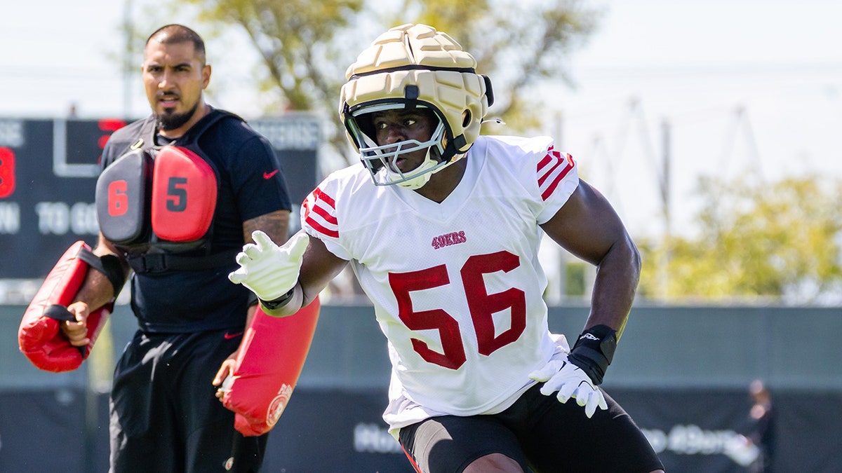 Tarron Jackson practices on field
