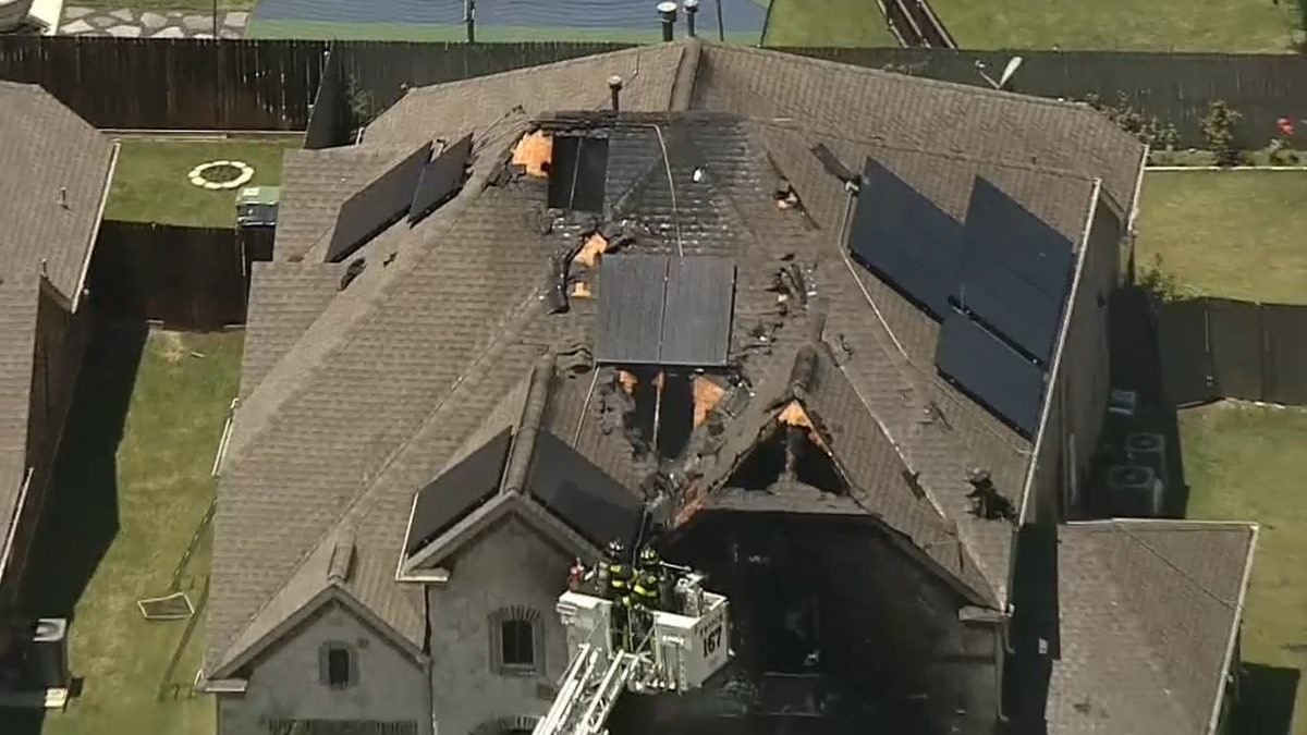 Large holes seen on roof of damaged home following fire reports
