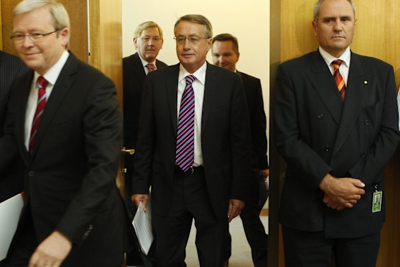 Then-Treasury secretary Ken Henry (right), prime minister Kevin Rudd and treasurer Wayne Swan in 2010. 