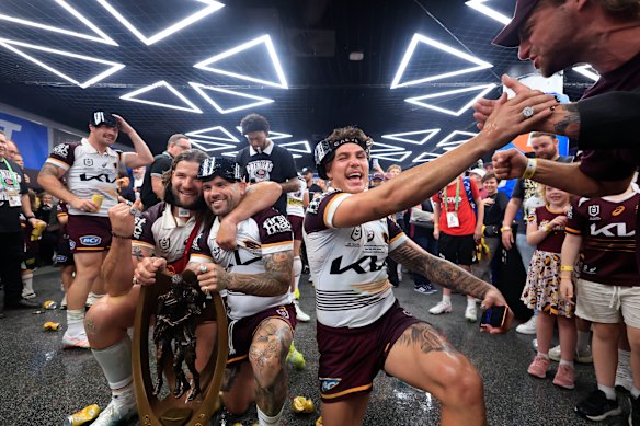The Brisbane Broncos celebrate their win over the Melbourne Storm in the NRL grand final on Sunday night.