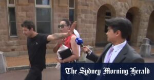 Supporters lash out at cameras outside court