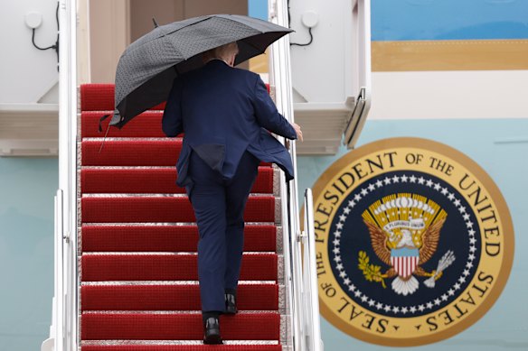 Trump walks up the stairs of Air Force One for his flight to the Middle East.