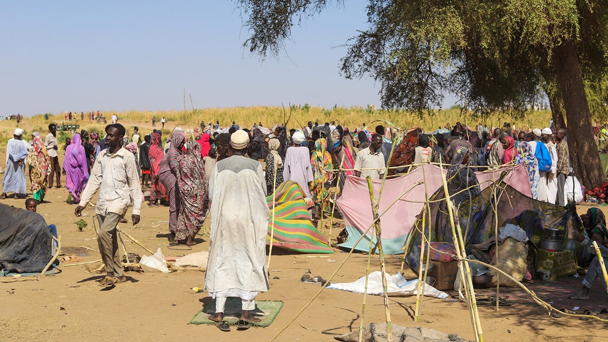 Sudanese who fled el-Fasher city, after paramilitary Rapid Support Forces (RSF) killed hundreds of people in the western Darfur region, gather at their camp in Tawila, Sudan, Wednesday, Oct. 29, 2025.