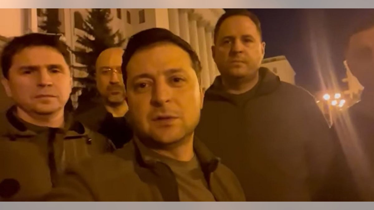Ukrainian President Volodymyr Zelenskyy posing with other officials.