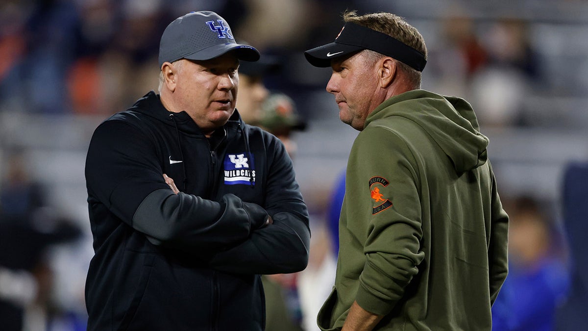 Mark Stoops and Hugh Freeze chat