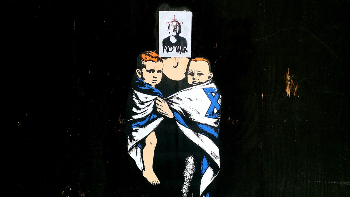 Shiri Bibas and sons memorial mural in Milan defaced with crying boy image