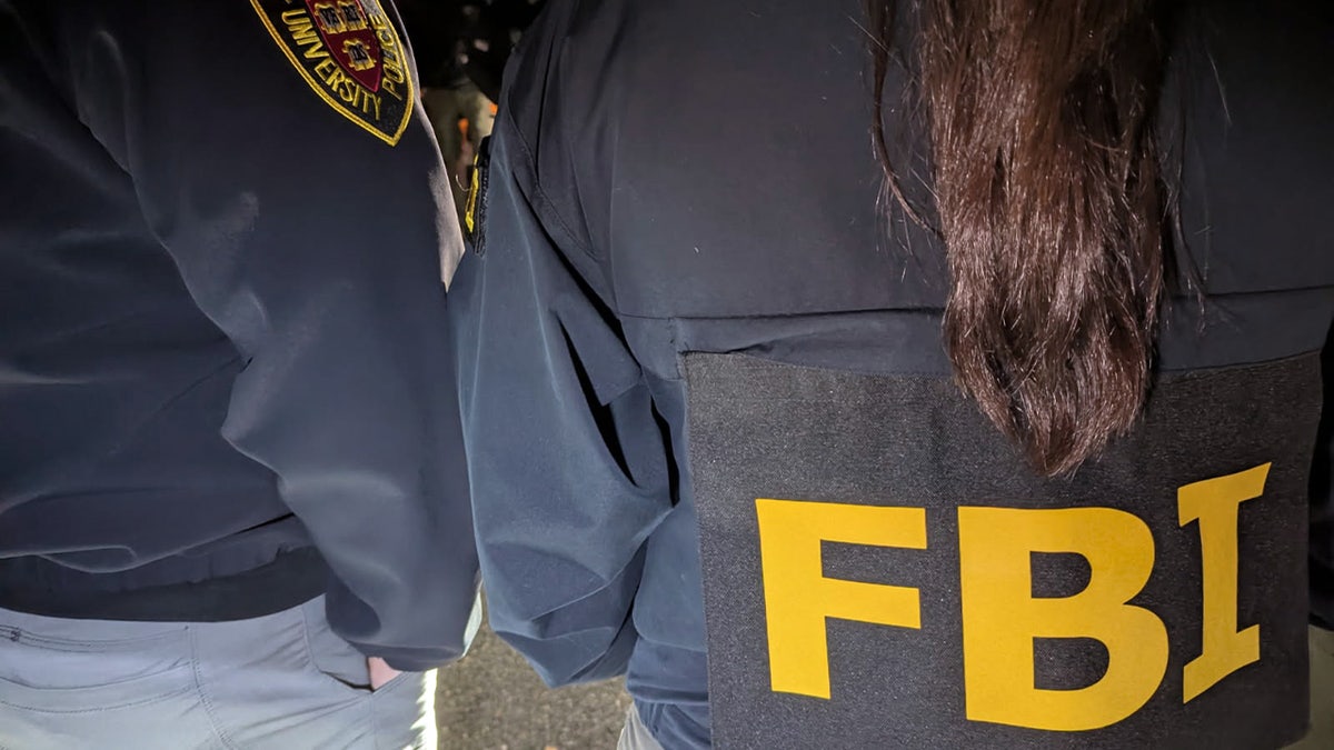 Two officers. One officers from the Harvard University Police Department and a second agent from FBI Boston.