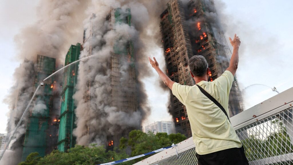 Fire tears through Hong Kong housing complex, killing at least 13 with others reported trapped