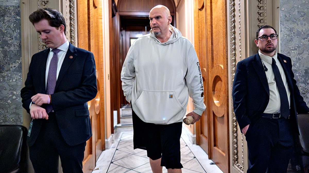 John Fetterman walking halls of Senate chamber