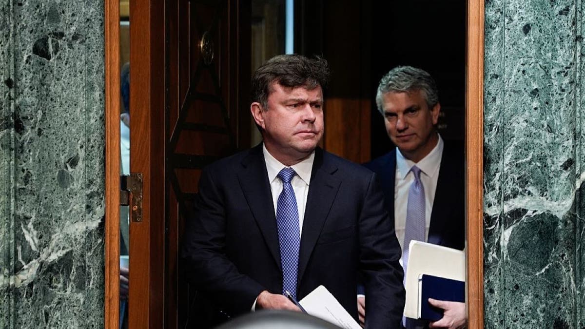 John Hurley preparing to speak to Congress