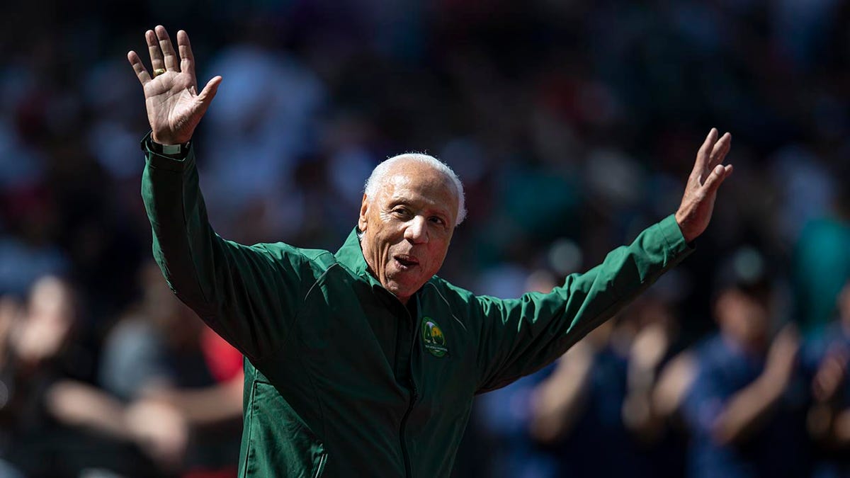 Lenny Wilkens waves to crowd