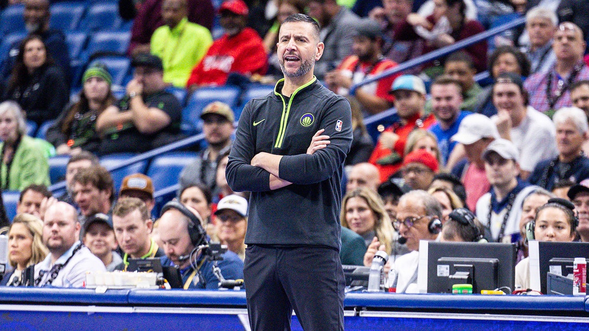 James Borrego looks on during a game