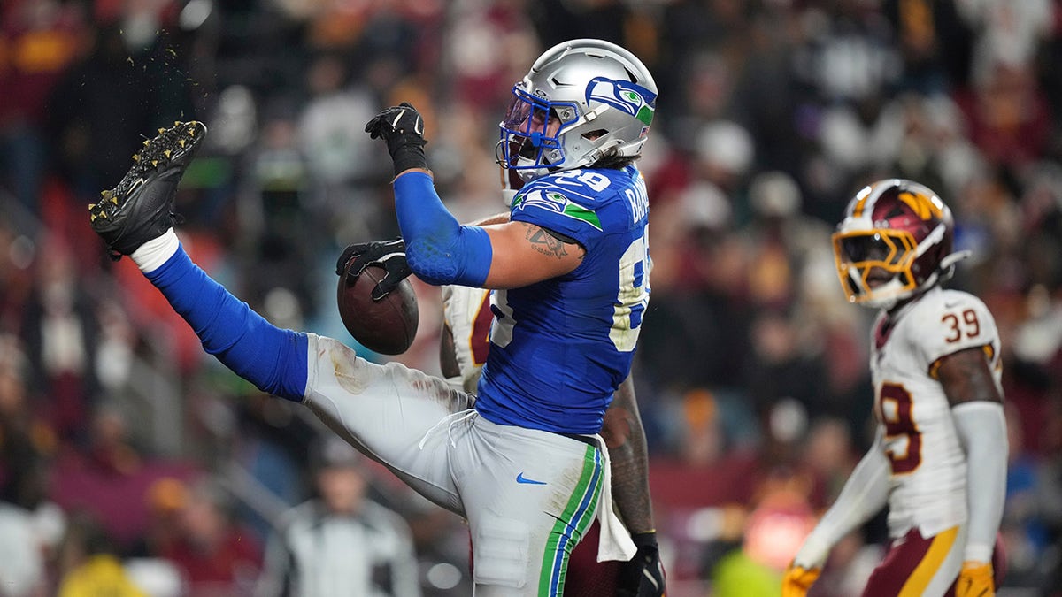 AJ Barner celebrates a touchdown