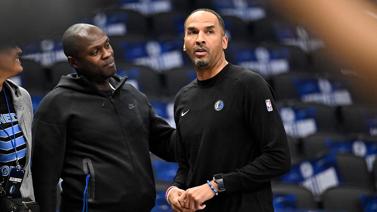 Nico Harrison looks on court