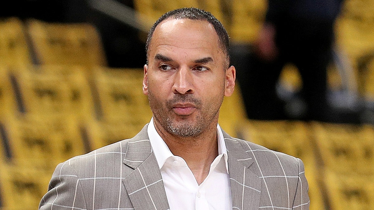 Nico Harrison looks on