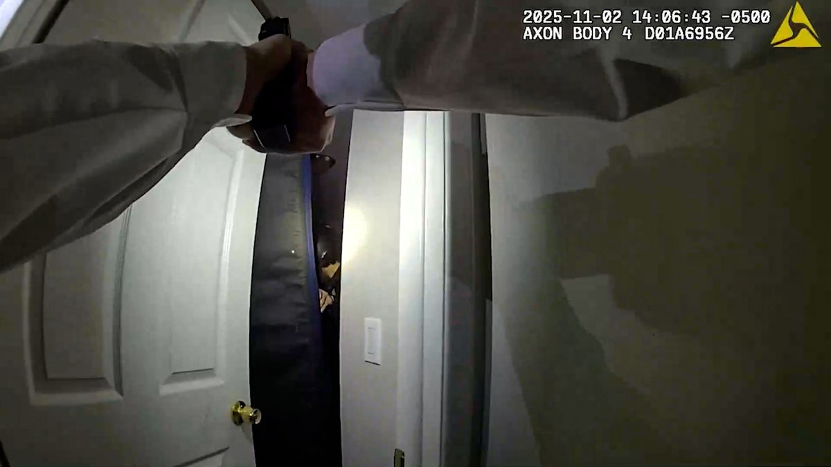 mattress barricades door as police holds up gun