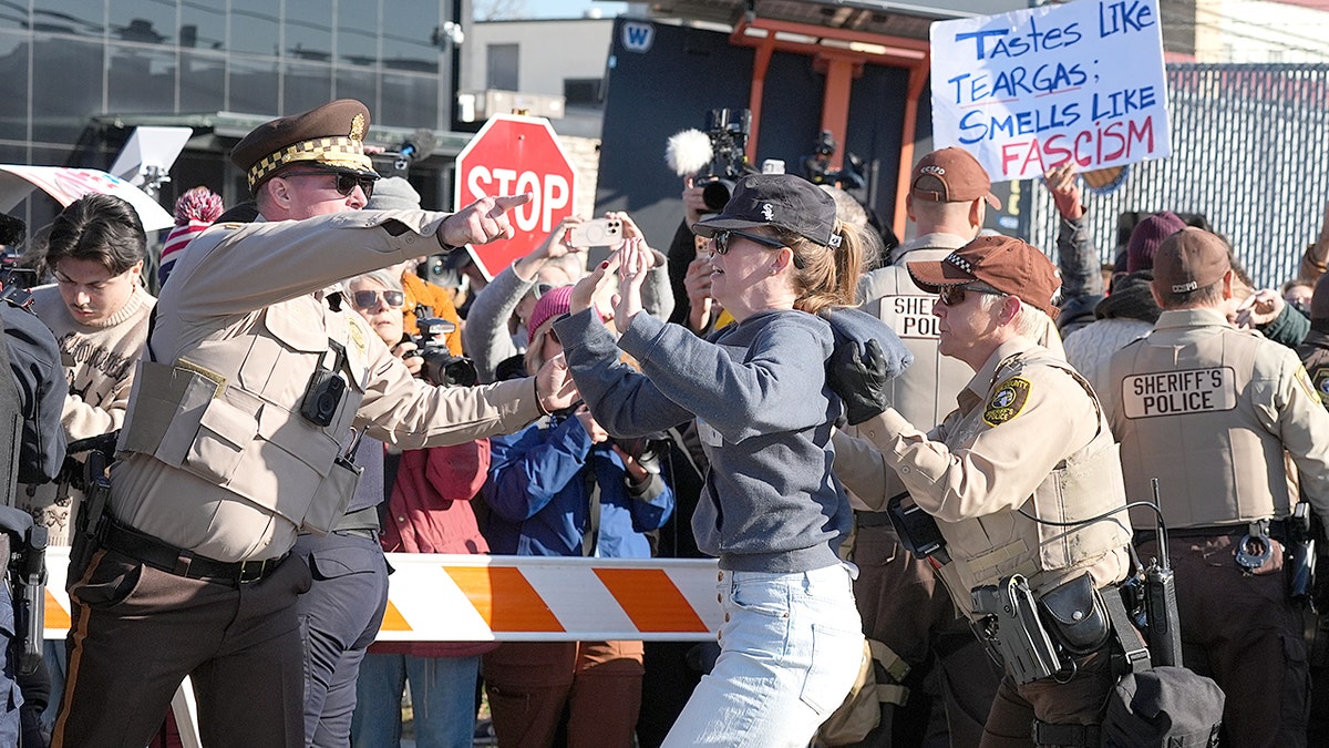 Police clash with ICE protesters.