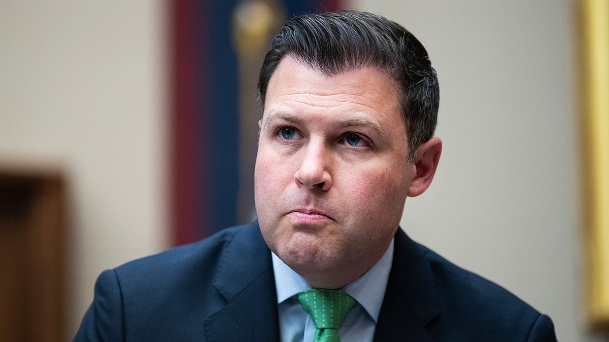 Ryan Mackenzie sits in a committee hearing