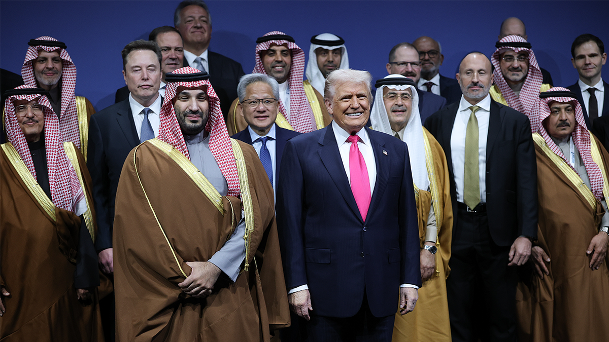 U.S. President Donald Trump and Crown Prince and Prime Minister Mohammed bin Salman of Saudi Arabia stand for a photo with Tesla CEO Elon Musk, Nvidia CEO Jensen Huang and other participants at the U.S.-Saudi Investment Forum at the Kennedy Center.