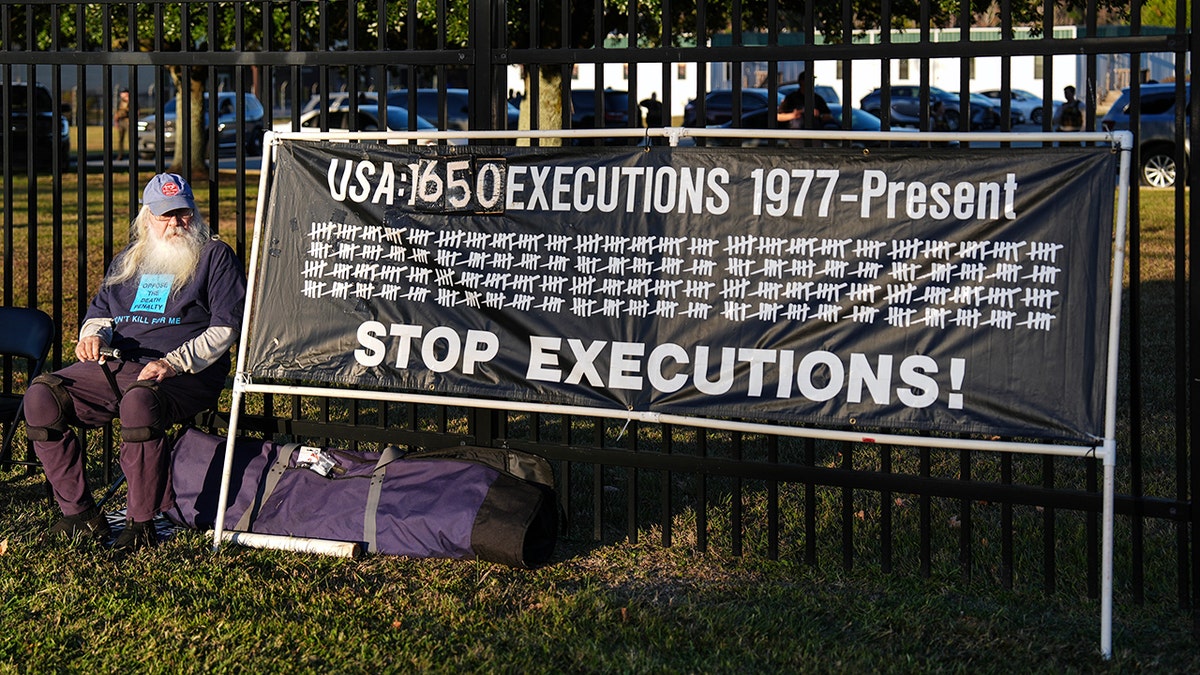 Protester with sign outside of Broad River Correctional Institute in Columbia, S.C.