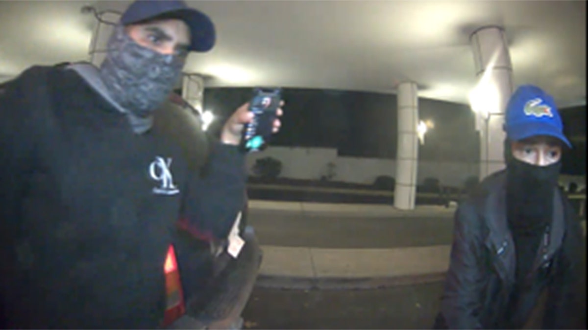 Surveillance footage of two suspects wanted in an ATM robbery