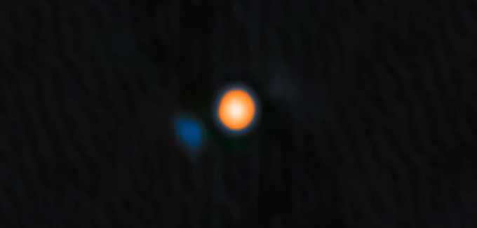 A round blue spot hovers just to the left of a bright yellow bigger circle.