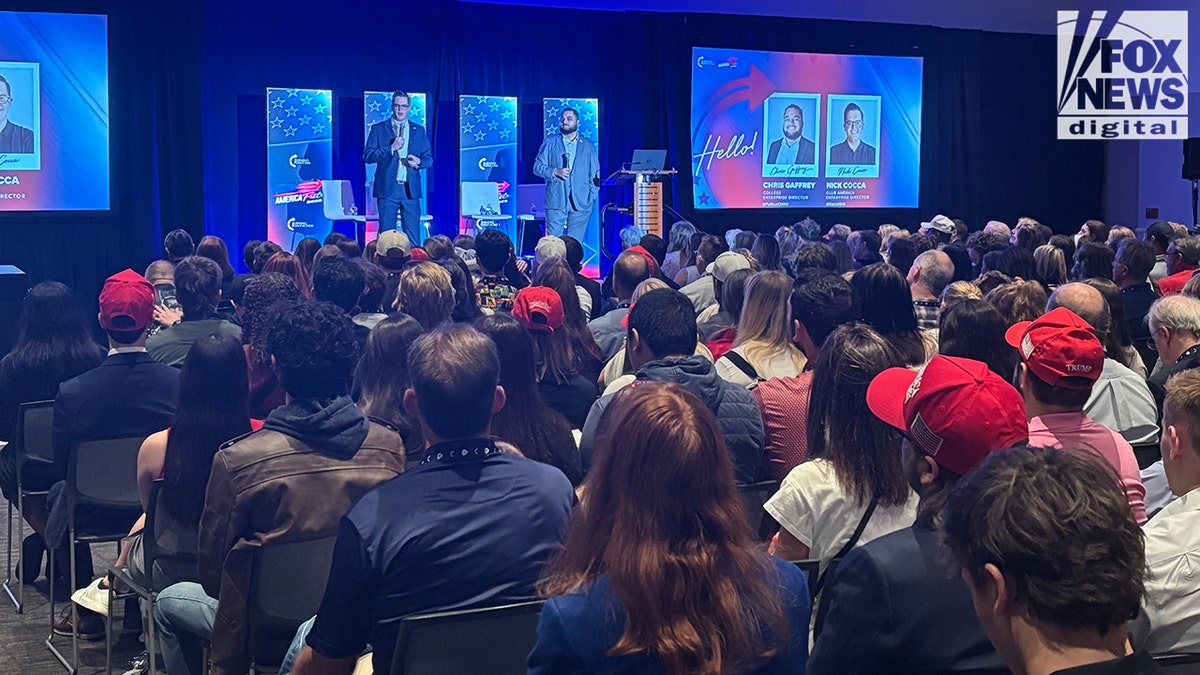 Group of people looks at stage at TPUSA AmericaFest event in Phoenix